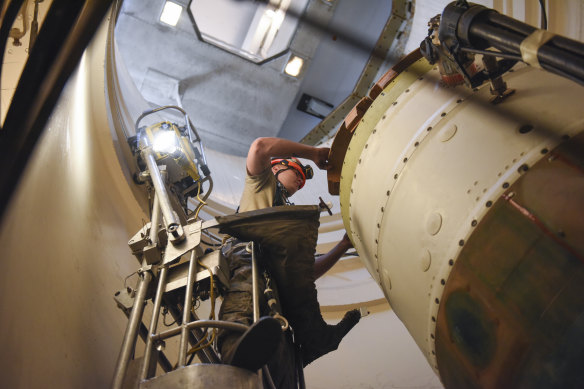 A US Air Force airman prepares a spacer on an intercontinental ballistic missile in Great Falls, Montana. 