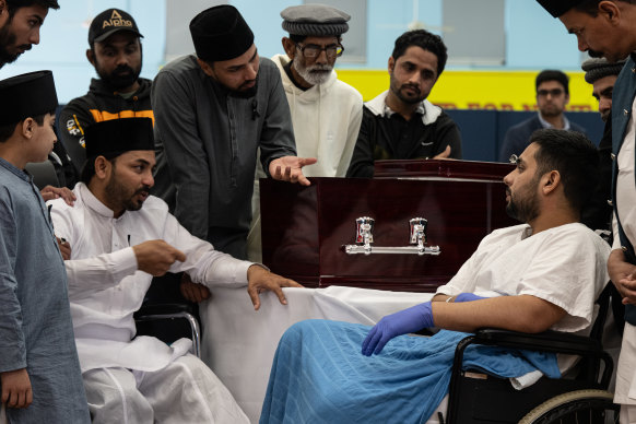 Muzafar Ahmed Tahir, brother of Faraz Tahir meets Muhammad Taha (wearing blue gloves) who was the security guard with Faraz at the time of the attack.