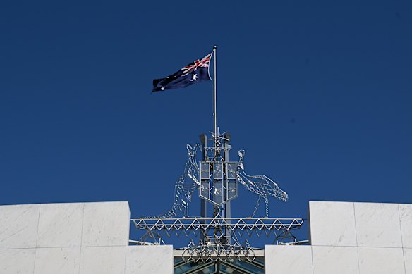 The Australian flag is seen at full mast after the Proclamation of King Charles III, on the forecourt of Parliament House, in Canberra.