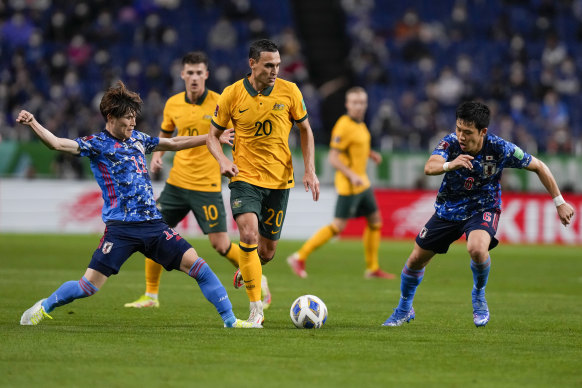 Trent Sainsbury, centre, competes for the ball with Japan’s Kyogo Furuhashi, left, and Wataru Endo on Tuesday night.