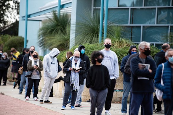 People lining up to be tested on Monday as Perth grapples with two parallel outbreak threats.  