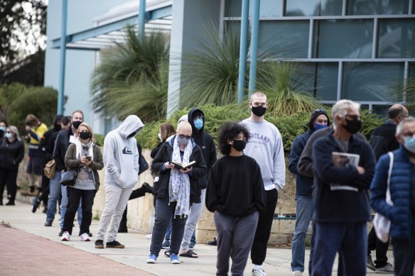 People lining up to be tested on Monday as Perth grapples with two parallel outbreak threats.  