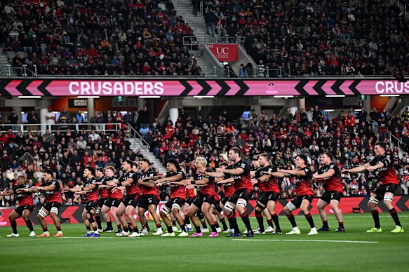The Crusaders perform a haka before kickoff.