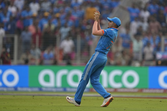 India’s Shubman Gill takes the catch to get Pakistan’s Hasan Ali out.