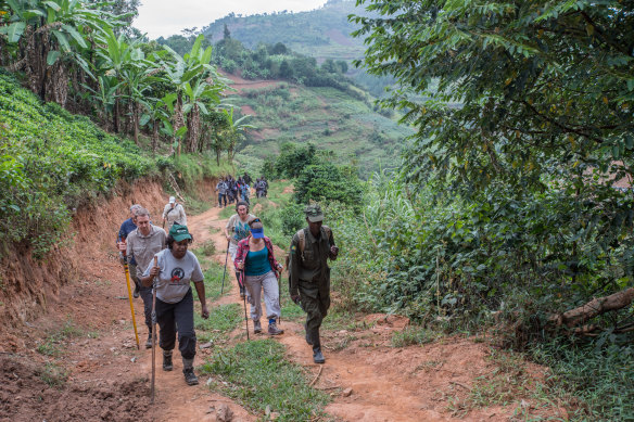Dr. Kalema-Zikusoka leads tourists on a gorilla trek in Bwindi. “Once a community member meets a tourist, they’re much less likely to poach, much less likely to destroy the habitat.”