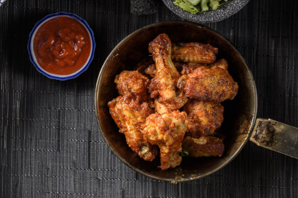 Chicken wings: an easy favourite able to be delivered to guests en masse.
