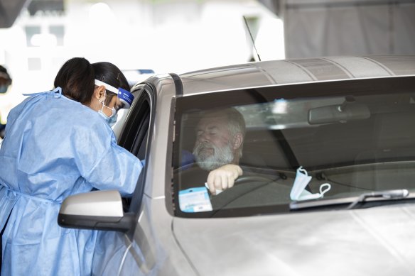 A drive-through COVID-19 clinic in Perth tests residents for the virus.