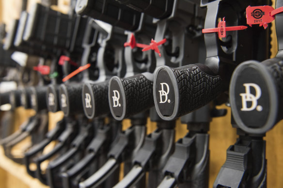 A row of AR-15 style rifles manufactured by Daniel Defense sit in a vault at the company’s headquarters in Black Creek, Georgia. 