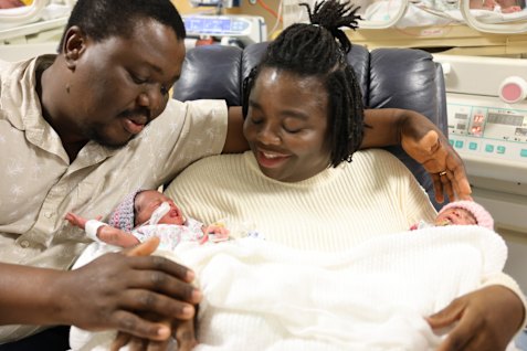 Belinda and Emmanuel Lotsu with two of their four newborn babies.