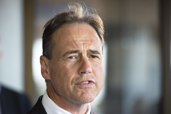 Federal Health Minister Greg Hunt - wants the footy to go ahead.
