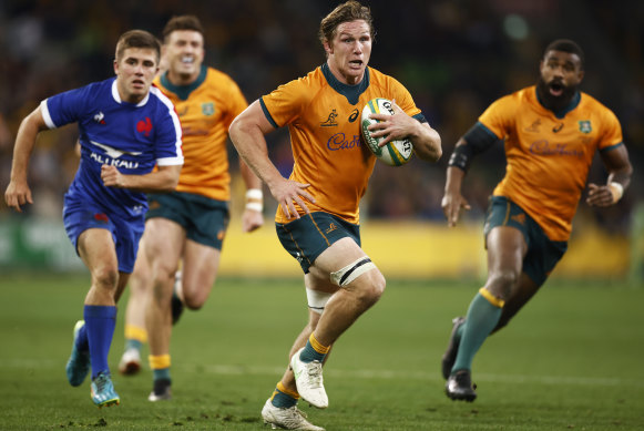 Michael Hooper of the Wallabies runs in to score a try against France.