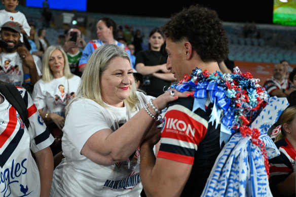 Mark Nawaqanitawase embraces his mum Fiona Tovehi after his NRL debut.