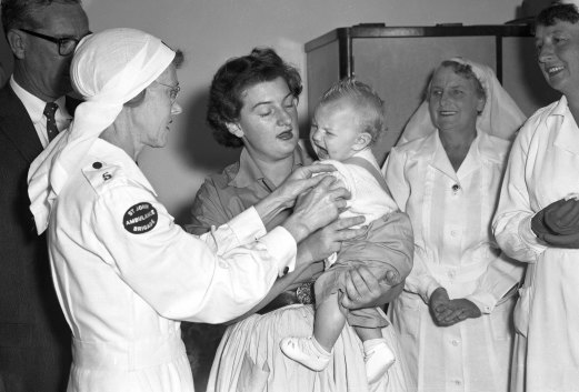 Leann Warbrook, nine months of Balmain was the millionth child in NSW to receive a Salk anti-polio vaccination.