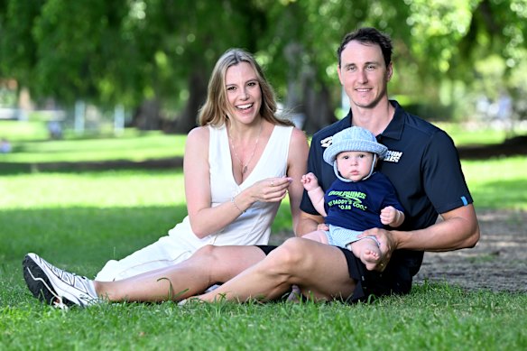 Swimmer Cam McEvoy and wife Madi pose for as photo with their baby Hartley in Brisbane on Wednesday. 