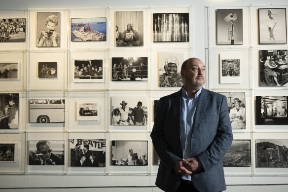 Curator Geoff Barker with the inaugural exhibition Shot in the State Library of NSW’s new permanent photography gallery.