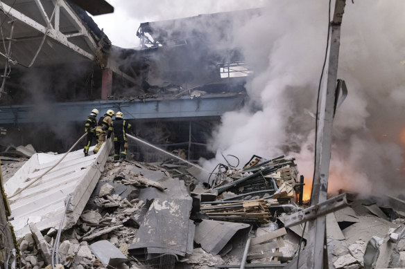 Firefighters work to extinguish a fire after a Russian attack in Kharkiv, Ukraine, last week.