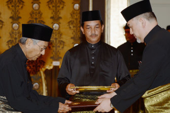 Mahathir Mohamad, now 92, is sworn in by Malaysia's constitutional monarch, Muhammad V.