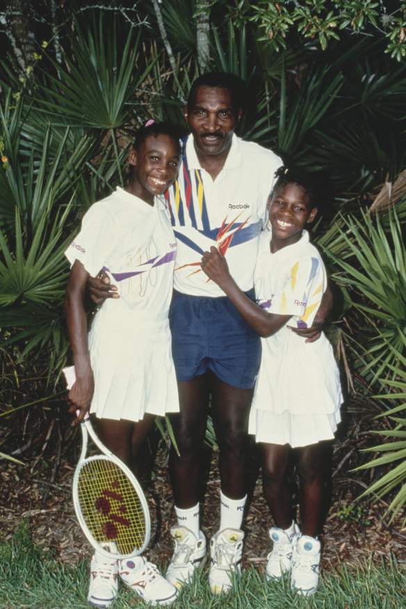 Venus and Serena Williams (at right) with their father Richard in 1992. “I would be devastated if I wasn’t
pushed,” she says of his drive for them to succeed.