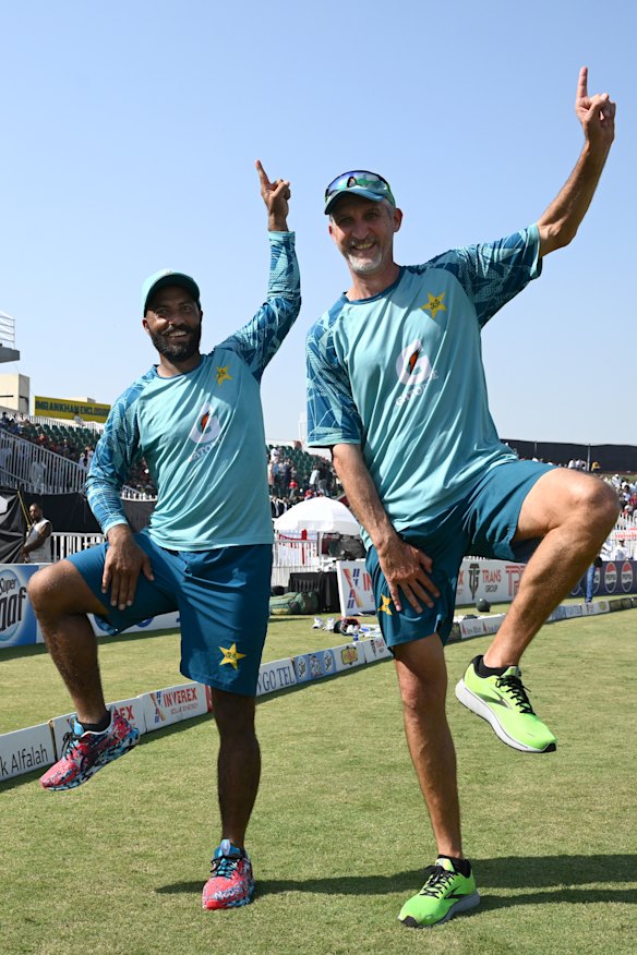Sajid Khan does a trademark celebration alongside Jason Gillespie after the recent Test series win against England.