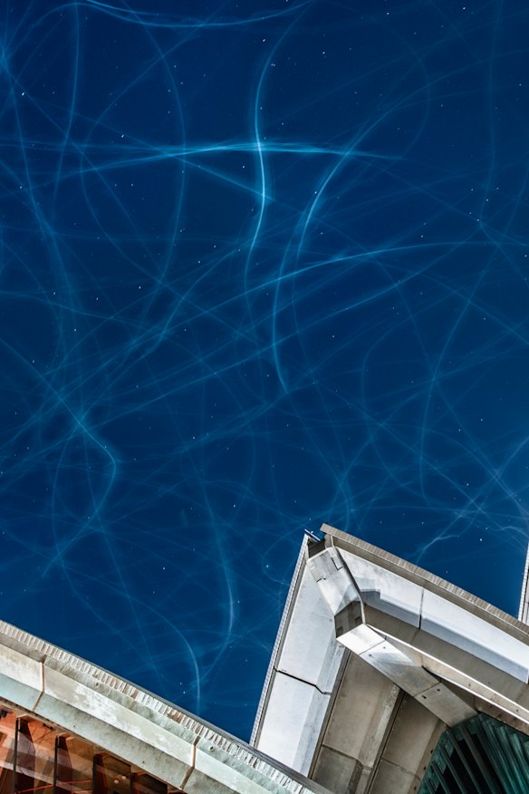 Long exposure showing seagulls chasing moths above the Sydney Opera House.