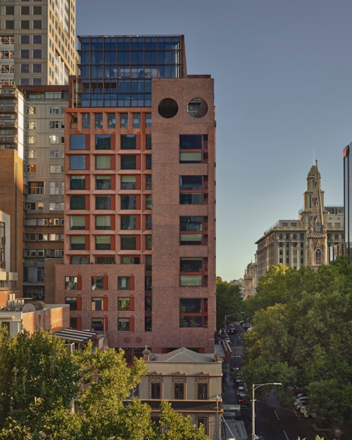 The precast concrete facade has a self-shading system of either steel or aluminium awnings.
