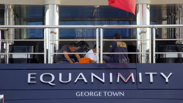 Indonesian police officers are seen on board the luxury yacht Equanimity off Bali.