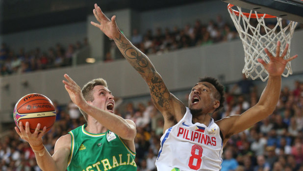 Jesse Wagstaff attempts to score under pressure from Calvin Abueva of the Philippines during the FIBA World Cup qualifier match at Margaret Court Arena on  Thursday.