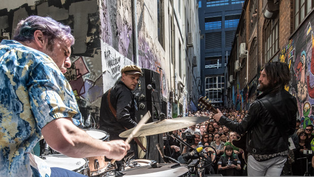 Aussie rockband Jet performing a pop up gig in AC/DC Lane as part of a tour announcement.