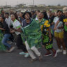 MK Party supporters celebrate in the middle of the street in Mahlbnathini village in rural KwaZulu-Natal, South Africa.