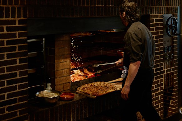 Dishes are cooked in the hearth of the open kitchen.