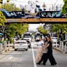 The train bridge north of Balaclava station as it crosses Carlisle Street, featuring the Lady of St Kilda art work.