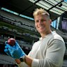 Jason Warne holds the ball bowled by his Dad at the MCG on Friday.