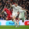 Liverpool’s Mohamed Salah is challenged by Forest’s Nikola Milenkovic