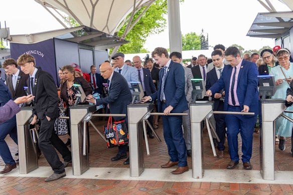 Racing fans enter Flemington ahead of the Cox Plate.