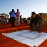 Noel Pearson signs the Uluru Statement from the Heart in May 2017.  
