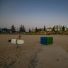 Beachgoers are seen near the Maroubra Rubik’s Cube at sunrise on Friday.