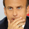 Macron tries to save his presidency by cutting taxes, elite school
