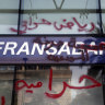 Graffiti accusing the bank of being thieves is written across the facade of a bank in Beirut, Lebanon, where withdrawals have been restricted. 