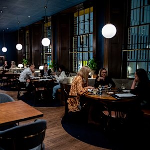 The Sanderson's plush booths and dining room.
