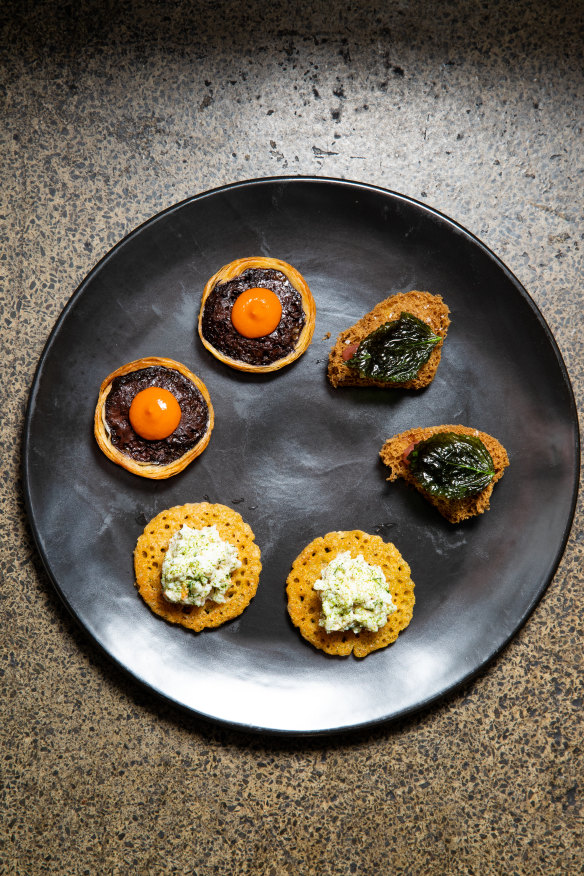 The snack plate with chickpea pancake and boudin tart. 