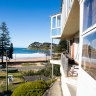 The ageing apartment block and deli at Whale Beach are owned by the Cassar tourism family.