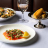 Clockwise from top left: Clams casino, crumpets and Ora King salmon gravalax at Bistro George in Sydney. 