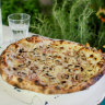 Boscaiola pizza with fresh cream, fior di latte, ham, mushrooms, parsley and parmesan.