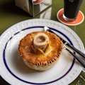 Hearty British-Euro plates include oxtail, snail and bone marrow pie.