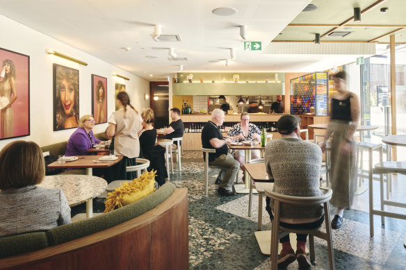 The eclectic dining room pops with terrazzo tiles, textured banquettes and local ceramics and artwork.