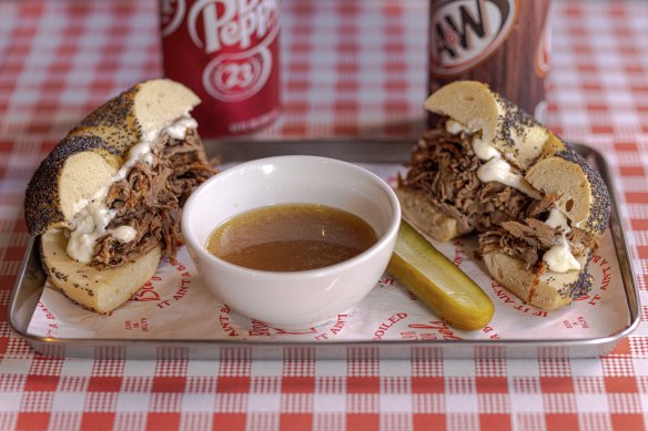 The French dip bagel comes with a bowl of broth for dipping into.