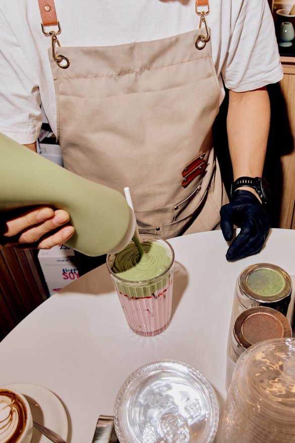 Preparing the strawberry matcha.
