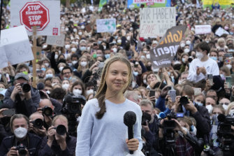 Swedish climate activist Greta Thunberg stands onstage during a Fridays for Future global climate strike in Berlin, Germany, Friday, Sept. 24, 2021.