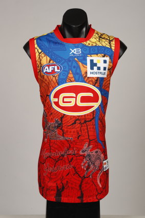 The Suns' colours feature on the jumper, but they're also traditional colours with yellow representing women and red representing men. 
"They’re both coming together on the one guernsey to represent our community,” said designer Luther Cora. 