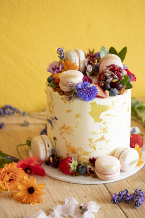 Tropical Coconut and Raspberry Cake from The Dessert Jar with edible flowers grown by Astrid.